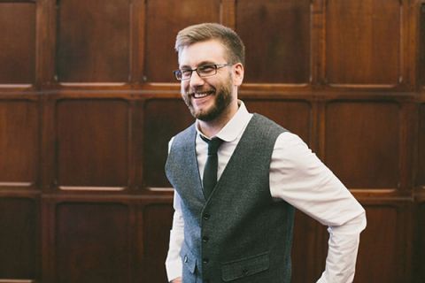 Dapper Groom in a Gray Vest | Robert J Hill Photography | See More: https://heyweddinglady.com/simple-and-elegant-grand-bohemian-hotel-wedding-from-robert-j-hill-photography/