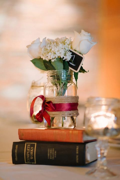 DIY Centerpieces with Vintage Books | Milton Photography | See More: https://heyweddinglady.com/ruby-and-gray-wedding-with-vintage-book-details-from-milton-photography/