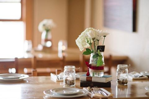 Simple White and Red Centerpieces | Milton Photography | See More: https://heyweddinglady.com/ruby-and-gray-wedding-with-vintage-book-details-from-milton-photography/