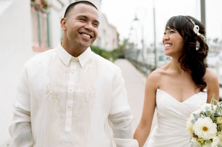 Our Handsome Groom wears a traditional Filipino Barong Tagalog with ivory embroidery | Tikko Weddings |See More: https://heyweddinglady.com/classic-and-glamorous-blush-and-gold-socal-wedding-from-tikko-weddings/