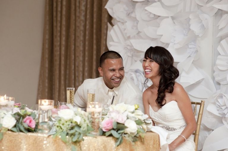 Blush and Gold Sweetheart Table in front of a Wall of Paper Flowers | Tikko Weddings |See More: https://heyweddinglady.com/classic-and-glamorous-blush-and-gold-socal-wedding-from-tikko-weddings/