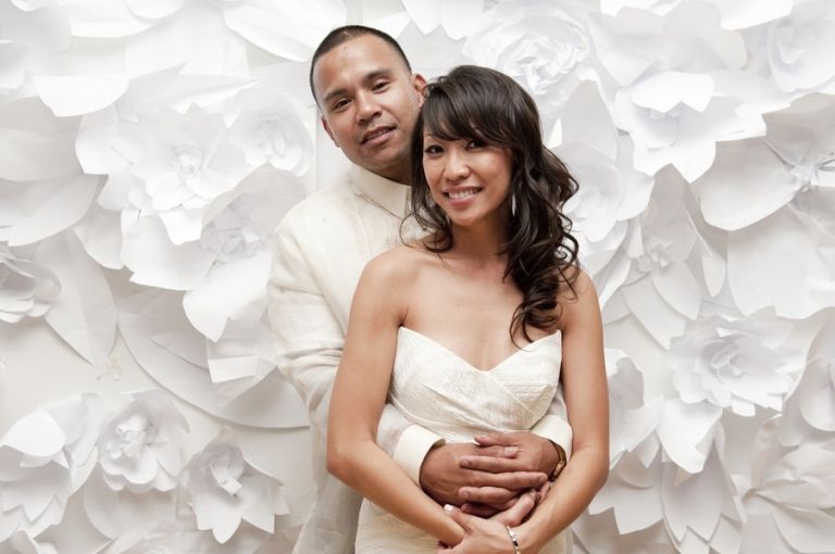 Love this custom backdrop of handmade paper flowers! | Tikko Weddings |See More: https://heyweddinglady.com/classic-and-glamorous-blush-and-gold-socal-wedding-from-tikko-weddings/