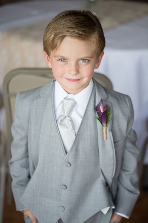 Is there anything cuter than a Ring Bearer in an itty bitty suit?! | Craig Hodge Photography | See More! https://heyweddinglady.com/elegant-simplicity-in-royal-purple-from-craig-hodge-photography/