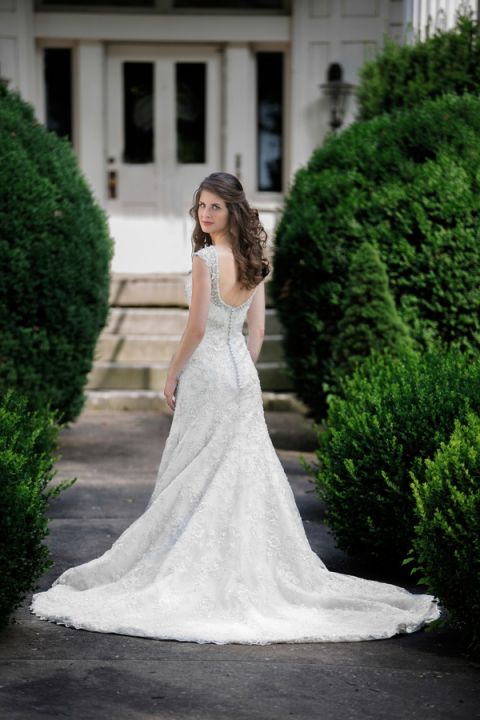 Swooning over this sparkling silver and lace wedding dress | Craig Hodge Photography | See More! https://heyweddinglady.com/elegant-simplicity-in-royal-purple-from-craig-hodge-photography/