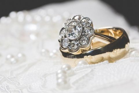 Vintage Flower Cluster Diamond Engagement Ring | Brit Jaye Photography | See More! https://heyweddinglady.com/vintage-nautical-wedding-on-a-yacht-from-brit-jaye-photography/