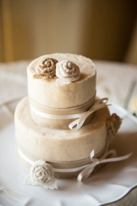 A Classic, Neutral Wedding Cake with Burlap Roses and Ribbon | Dawn Huemann Photography | See more! https://heyweddinglady.com/sweet-and-stylish-mountaintop-wedding-by-dawn-heumann-photography/