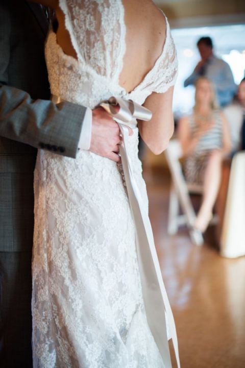 Gorgeous Lace Wtoo Wedding Dress with a Silver Sash | Dawn Huemann Photography | See more! https://heyweddinglady.com/sweet-and-stylish-mountaintop-wedding-by-dawn-heumann-photography/
