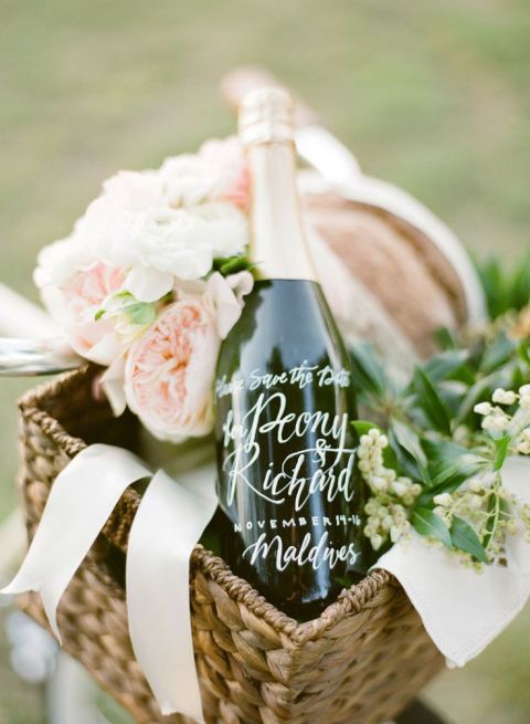 Romantic Picnic Basket with Calligraphy Champagne Bottle | KT Merry Photography | See More! https://heyweddinglady.com/elegant-country-manor-wedding-inspiration-in-marble-and-blush/