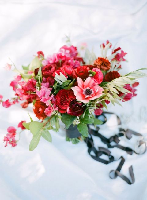 Red and Blue Beach Wedding Bouquet | Joel Serrato Photography | See More! https://heyweddinglady.com/driftwood-and-crimson-coastal-wedding-inspiration/