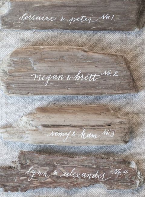 Calligraphy Driftwood Beach Wedding Escort Cards | Brooke Boling Photography | See More! https://heyweddinglady.com/driftwood-and-crimson-coastal-wedding-inspiration/