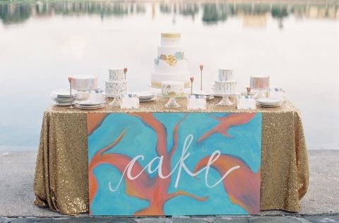 Vibrant Watercolor Wedding Cake Table in Glittering Gold, Aqua, and Burnt Orange | Kat Braman Photography | See More! https://heyweddinglady.com/modern-art-nouveau-wedding-inspiration-glittering-gold-orange-blue/