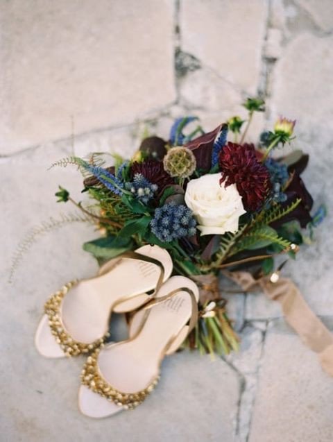 Gold Wedding Shoes and A Rich Blue and Burgundy Bouquet | Megan Pomeroy Photography | See More! https://heyweddinglady.com/farm-table-luxe-organic-wedding-inspiration/