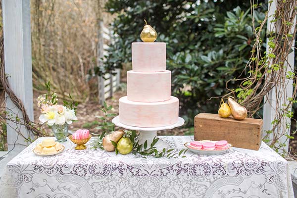 Marbled Wedding Cake Accented With Gold Leaf Pears And Pink