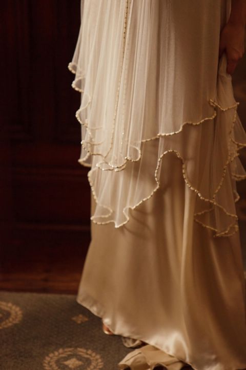 Beaded Chiffon Handkerchief Layers over a Champagne Silk Dress | Eye Wander Photography | See More! https://heyweddinglady.com/gold-and-champagne-wedding-in-new-orleans/