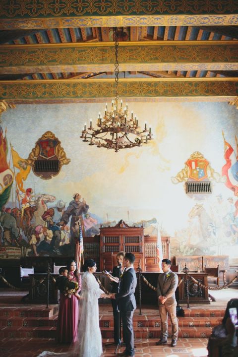 Ceremony in the Mural Room of the Santa Barbara Courthouse | Yes, Dear. Studio | Old World Spanish Inspired Wedding