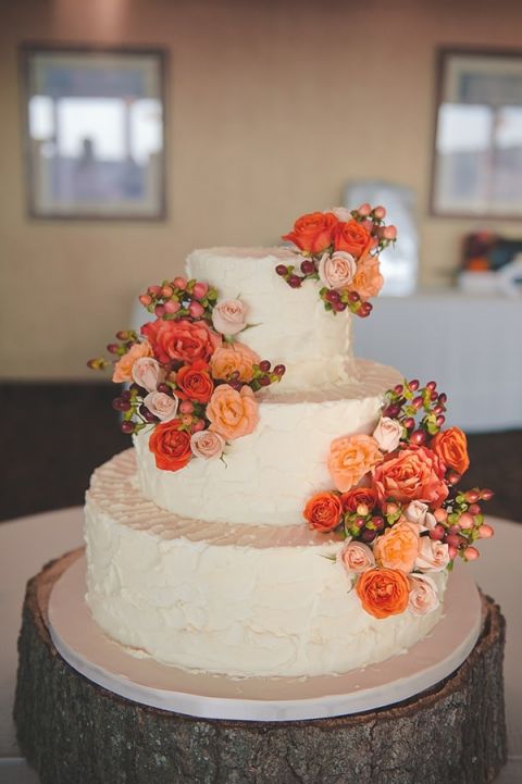 Orange and Peach Roses on a Simple Wedding Cake with a Tree Trunk Stand | Bit of Ivory Photography | Traditional Autumn Wedding in Eggplant and Orange