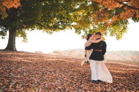 An Officer and a Gentleman Carry under the Fall Leaves | Bit of Ivory Photography | Traditional Autumn Wedding in Eggplant and Orange