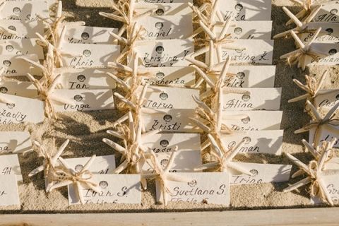 Starfish and Sand Dollar Escort Card Display | Vitaly M Photography | Black Tie Coastal Wedding with Classic Beach Details