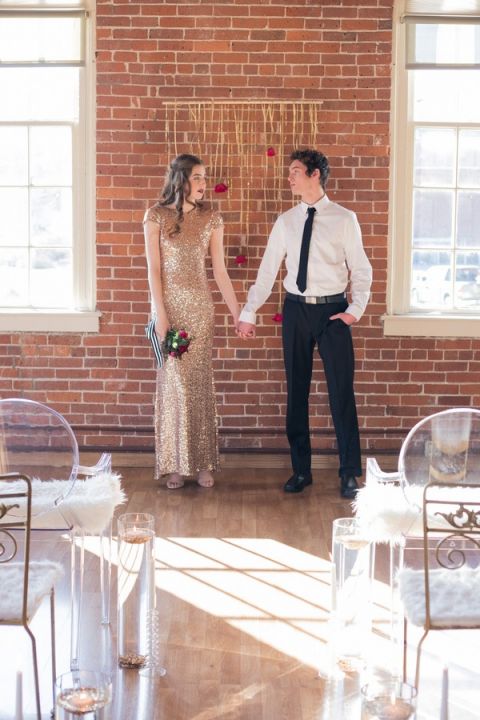 Modern Glam Wedding Ceremony with Exposed Brick Walls and a Gold Ribbon Backdrop | Kim Lyn Photography | Sequins and Stripes for an Industrial Glam Loft Wedding