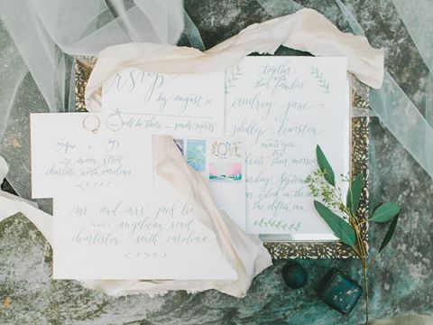 Sweet Botanical Inspired Calligraphy Wedding Invitation | Rachel May Photography and Amore Events by Cody | Garnet and Rose Gold - An Enchanted Garden Wedding Editorial - https://heyweddinglady.com/garnet-and-rose-gold-an-enchanted-garden-wedding-editorial/