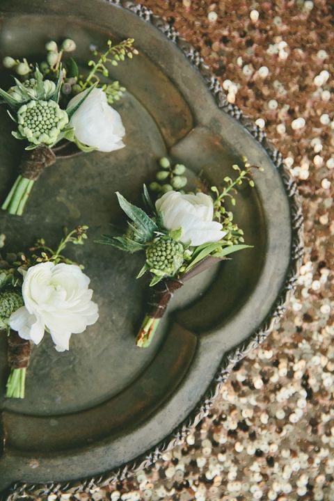 Green and White Boutonnieres on Bronze Sequins