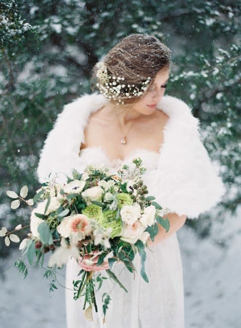 Ethereal Winter Bride in the Snow | Laura Leslie Photography | https://heyweddinglady.com/cozy-glam-winter-wedding-ideas/