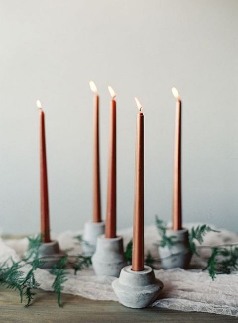 Slim Mocha Taper Candles in Marble Holders | Lauren Peele Photography | https://heyweddinglady.com/rich-romantic-garnet-mocha-wedding-valentines-day/