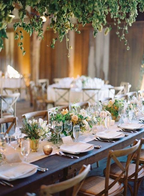 Rustic Farm Tables under a Greenery Chandelier