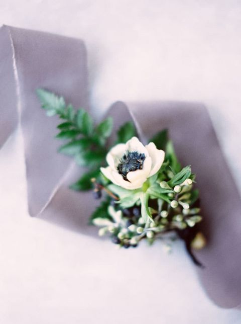 Winter Greenery and Anemone Boutonniere