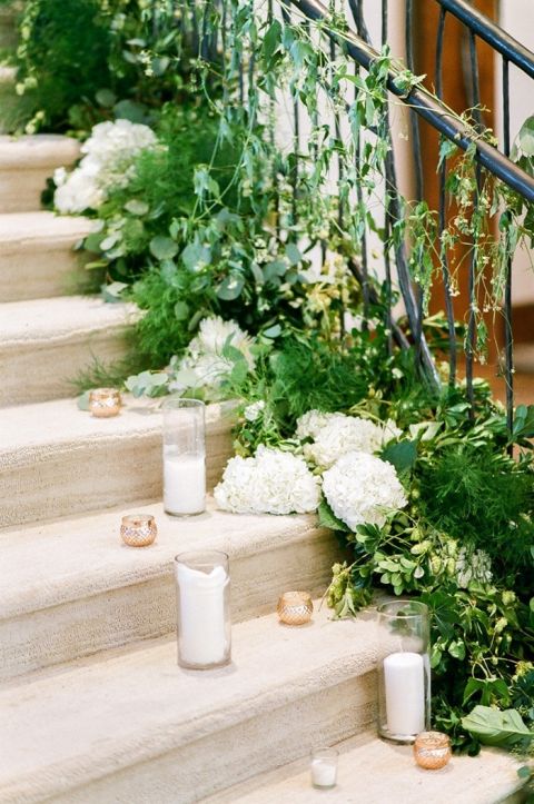 Spiral Staircase Decorated with Greenery and Candles