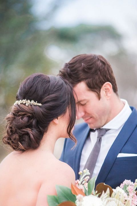 Romantic Bridal Updo with a Gold Headpiece