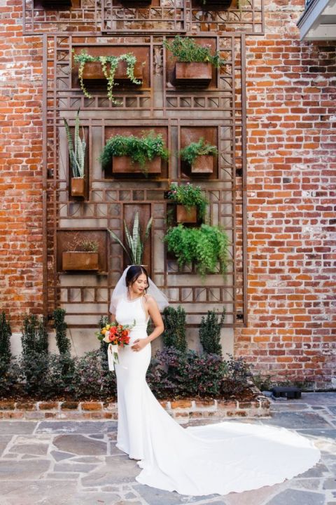 Living Greenery Brick Wall Backdrop for a Modern Chic Bride