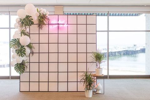 Handmade Geometric Ceremony Backdrop with a Neon Tropical Theme