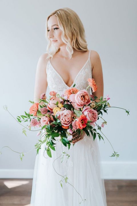 white wedding dress with colored flowers