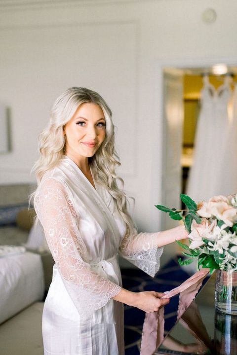 Bride Getting Ready for her Wedding Day in a Lace Robe
