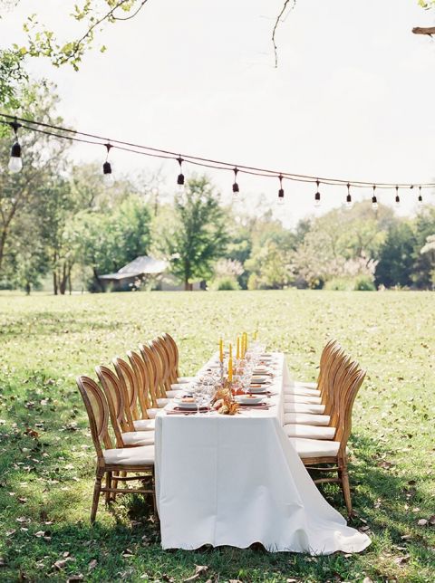 Long Reception Table for a Rustic Locally Sourced Wedding with Orange and Yellow Details