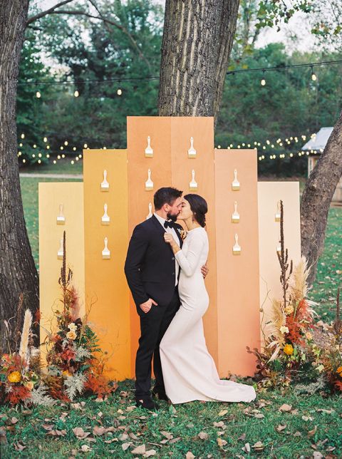 Colorful Fall Wedding with Artistic Accents including a Paintbrush Escort Wall