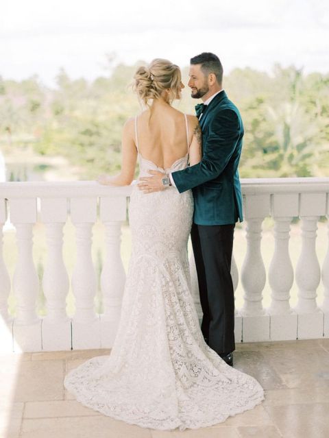 Glamorous Low Back Wedding Dress and a Green Velvet Suit for the Groom