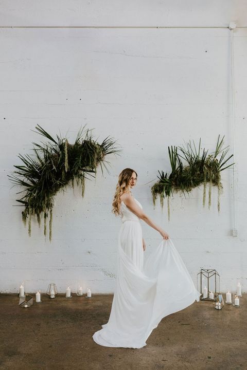 Adding an Indie Industrial Vibe to a Warehouse Ceremony with Dried Palm Frond Installations