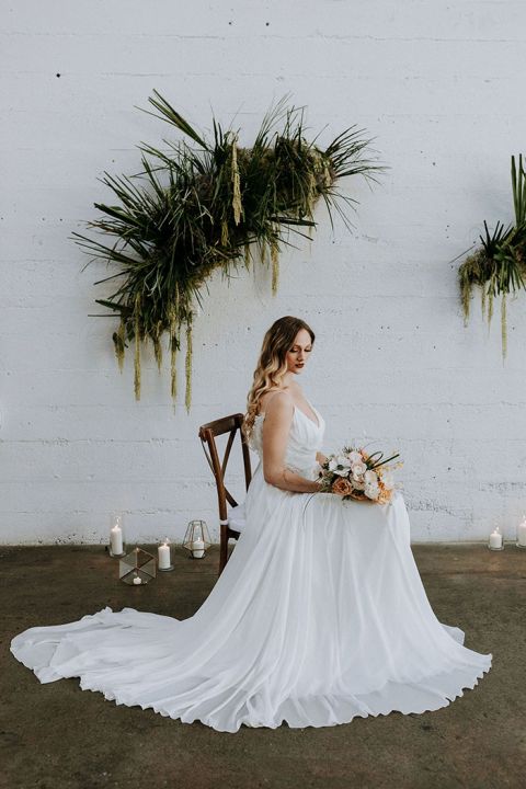 Adding an Indie Industrial Vibe to a Warehouse Ceremony with Dried Palm Frond Installations