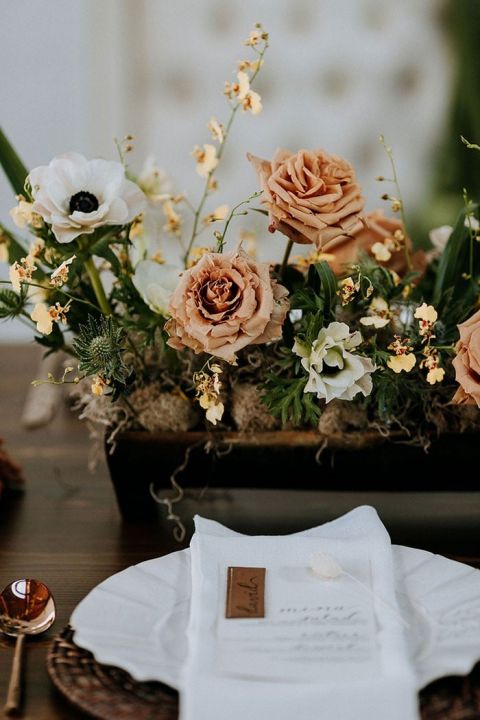 Cozy Neutral Place Setting with Leather Escort Cards, Toffee Rose, and Rattan Place Mats