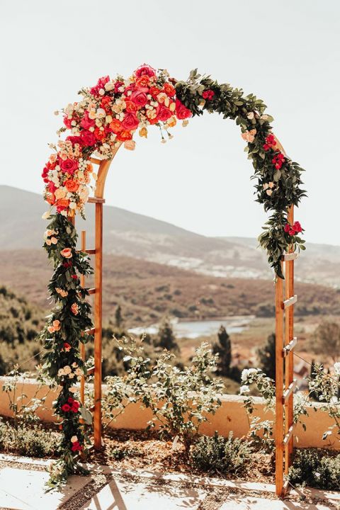 Colorful Fall Flowers for a Ceremony Arch at a Backyard Wedding in San Diego