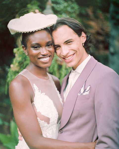 A Bridal Hat and Mauve Suit make for Fashion Forward Wedding Attire