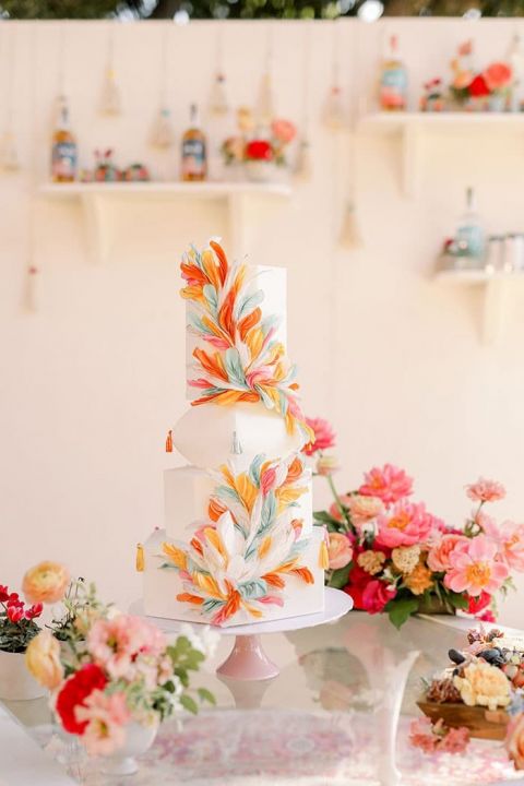 Colorful Work of Art Wedding Cake with a Feather Motif inspired by South American Textiles and Folk Art