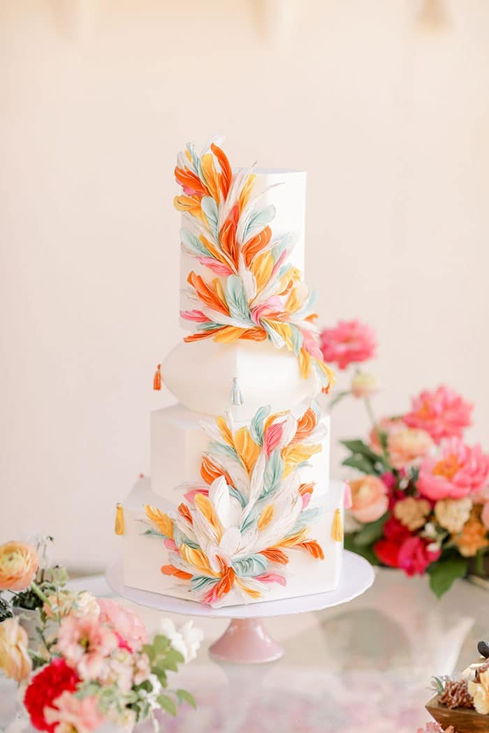 Colorful Work of Art Wedding Cake with a Feather Motif inspired by South American Textiles and Folk Art