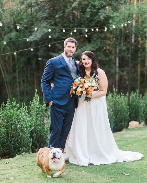 Bride and Groom with their Flower Dog walked Down the Aisle