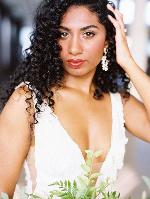 Open Neckline Wedding Dress with Natural Bridal Hair and a Modern Greenery Bouquet