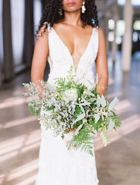Open Neckline Wedding Dress with Natural Bridal Hair and a Modern Greenery Bouquet