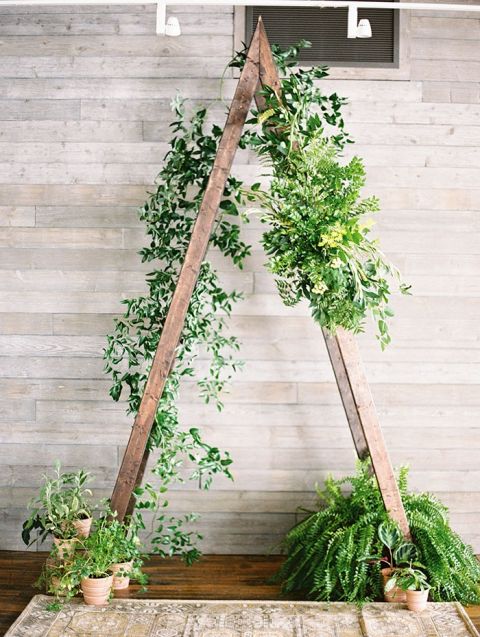 Modern Greenery Decor for a City Wedding Ceremony Backdrop on a Rusti Wood A-Frame