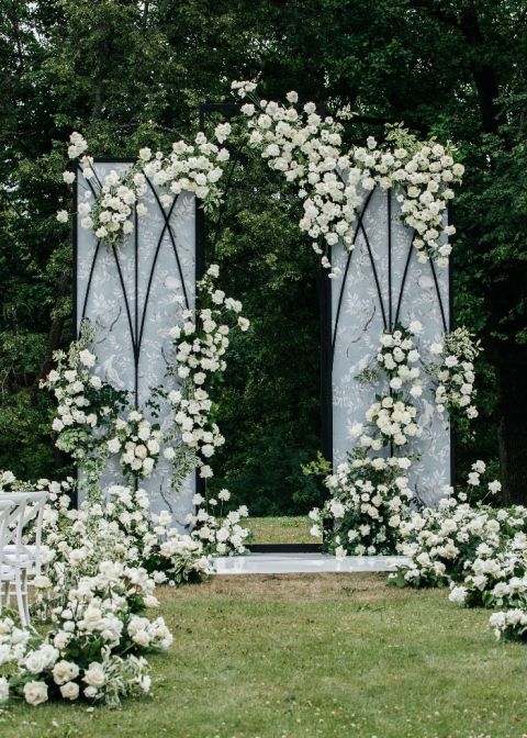 Asymmetric White Roses and Dramatic Cathedral Arches for a Moody Fairy Tale Wedding Ceremony